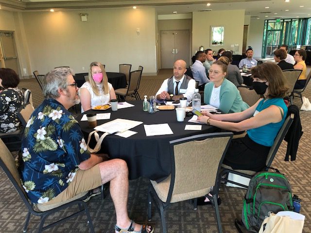 During the New Faculty Orientation, faculty discuss strategies to build community on the first day of class.