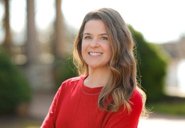 white woman wearing red shirt, Laura Bain '02