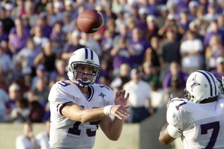 a quarterback throws a football during a game