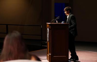 white man at podium. Patrick Flagler '23.