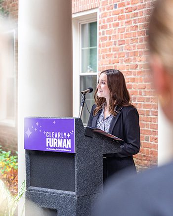 Woman speaks at lectern