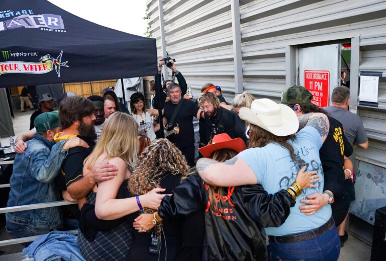 Marcus King, right, gathers backstage with members of his band, regional musicians and friends and family before performing at the Marcus King Family Reunion at the CCNB Amphitheatre at Heritage Park