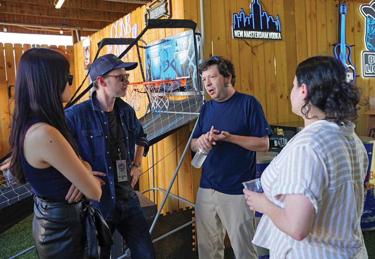 Charles Hedgepath, middle right, talks with members of Marcus King’s management team backstage of the CCNB Amphitheatre at Heritage Park during the Marcus King Family Reunion on August 25, 2024. Photo by Nathan Gray, Furman University