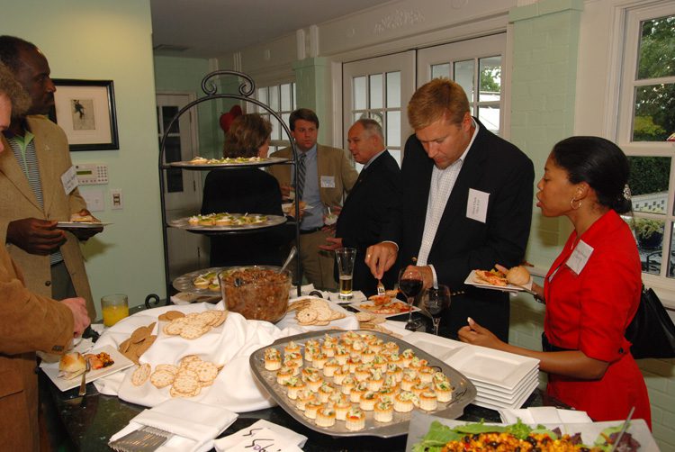 Forefront: Scott Clark and Monica Johnson (both Class VII) enjoying the camaraderie and hors d'oeuvres