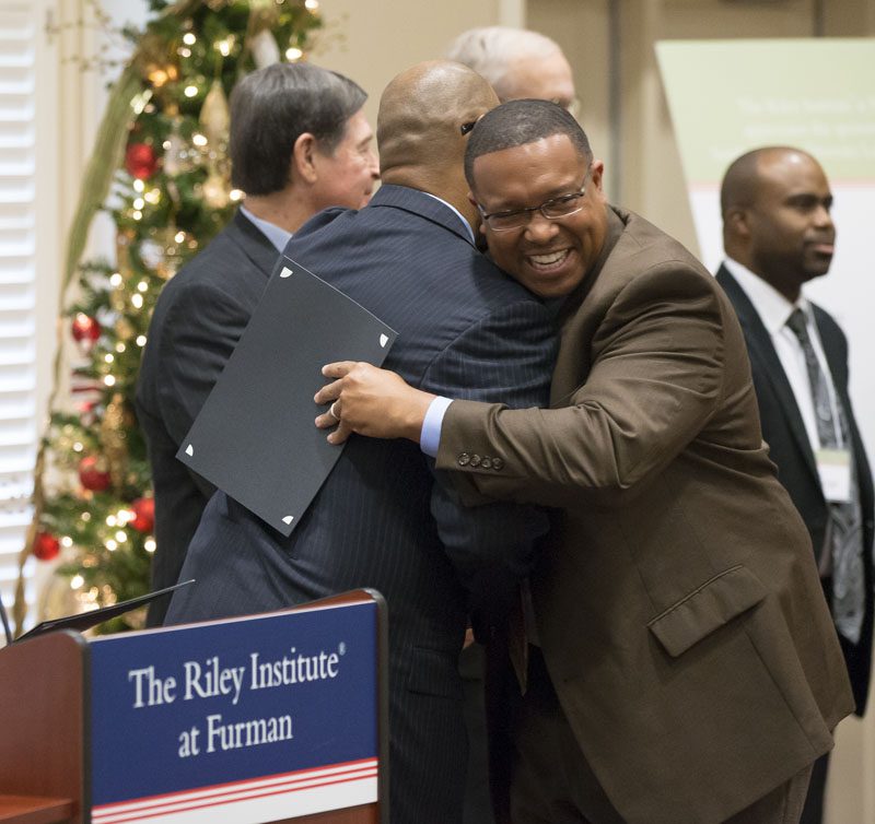 Juan gets another big hug from Rich Simons