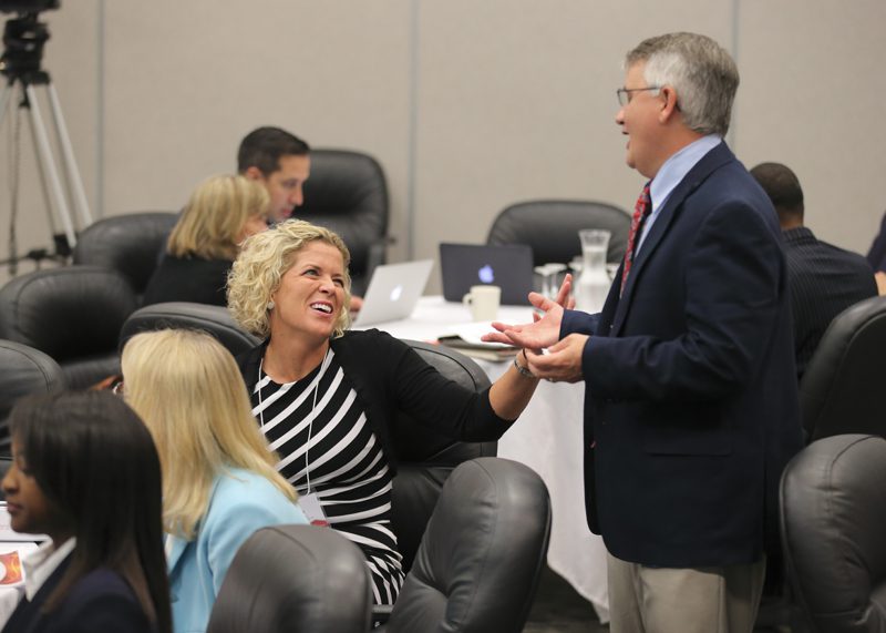 Annie Brown and Doug Taylor share a laugh before the presentations begin.