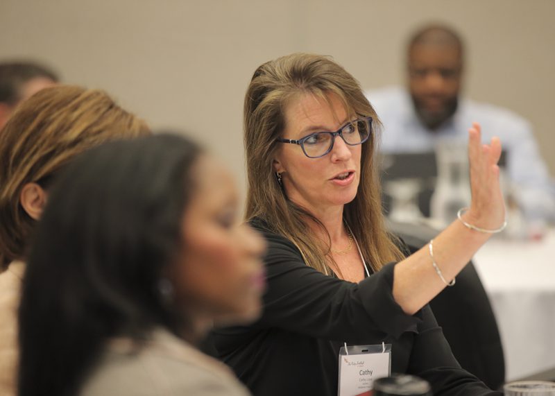 Cathy Love (right) shares an idea with Cathy Monetti and Traci Cooper.