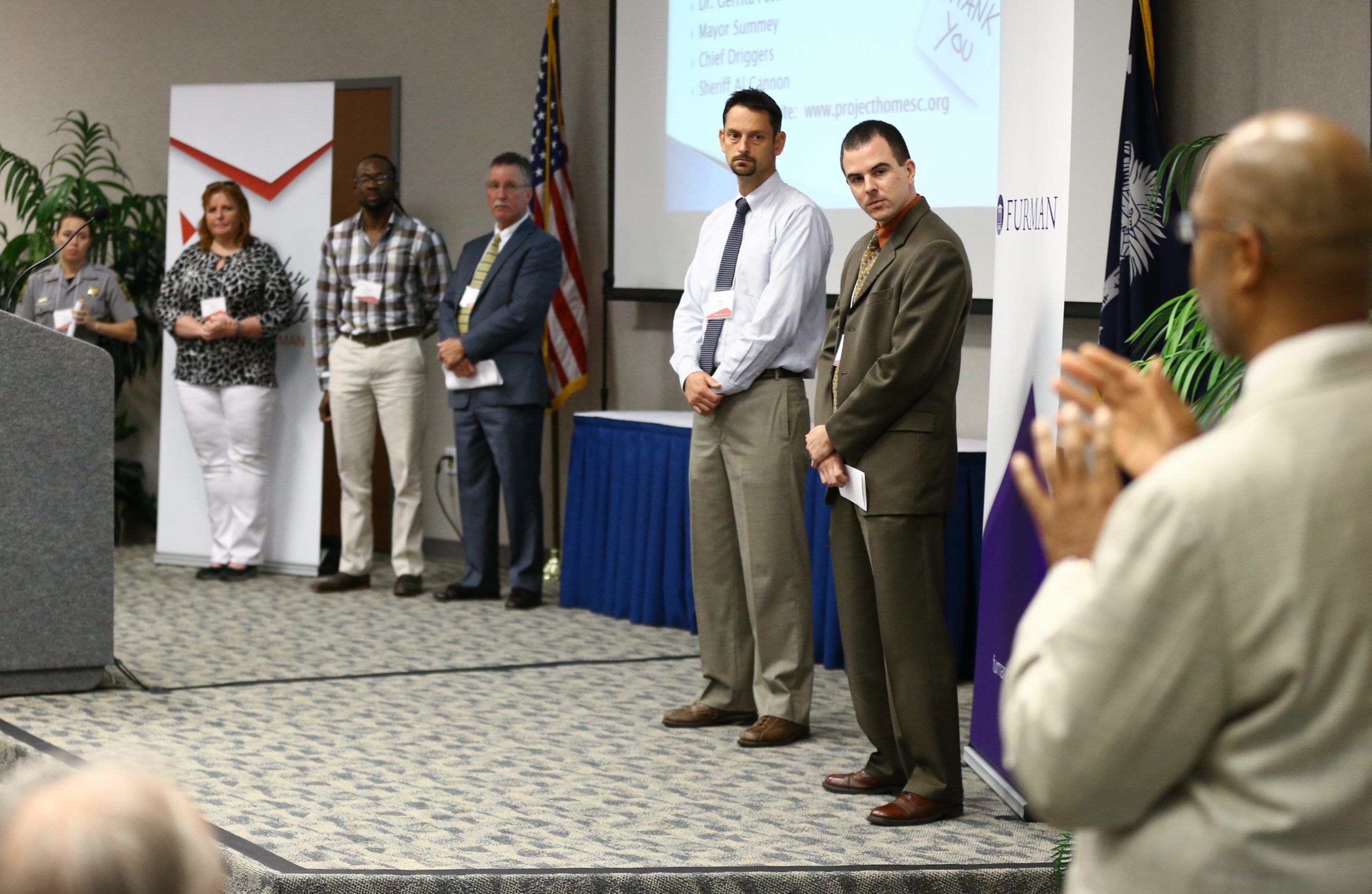 Juan Johnson speaking to team members, Charleston: A Warrior H.O.M.E.