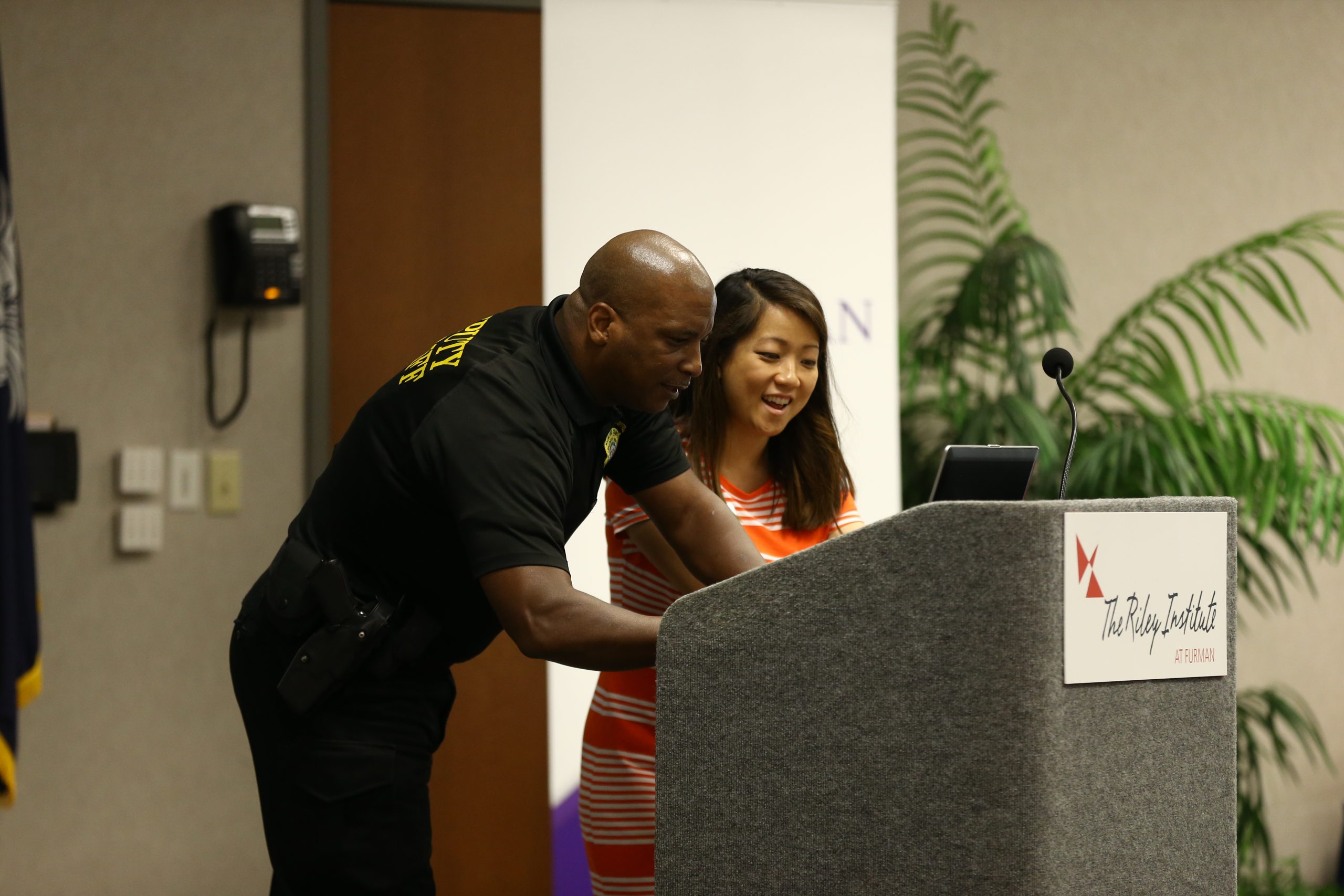 Shawn McDaniels, Lexington-Richland, and Megan Dodgens, Manager of the Diversity Leadership Programs, working on the powerpoint presentation