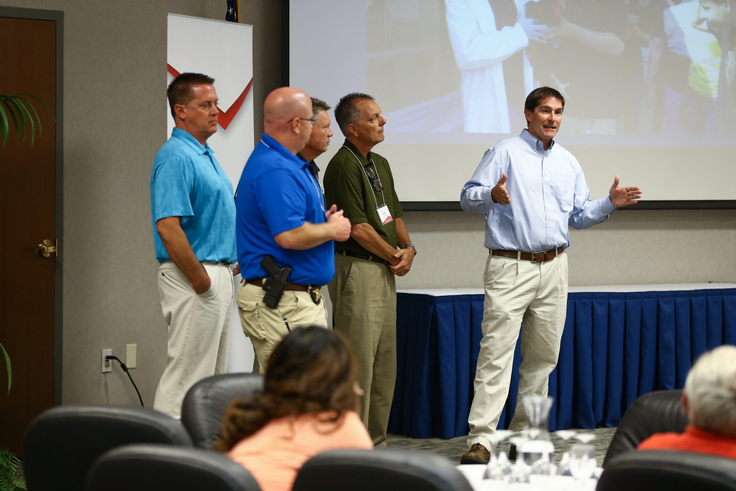 Brian Couch speaking, and (l-r) Greg Hayden, Matt Szymanski, Derek Roland and Randy Abbott, Anderson: Bulldogs for Business