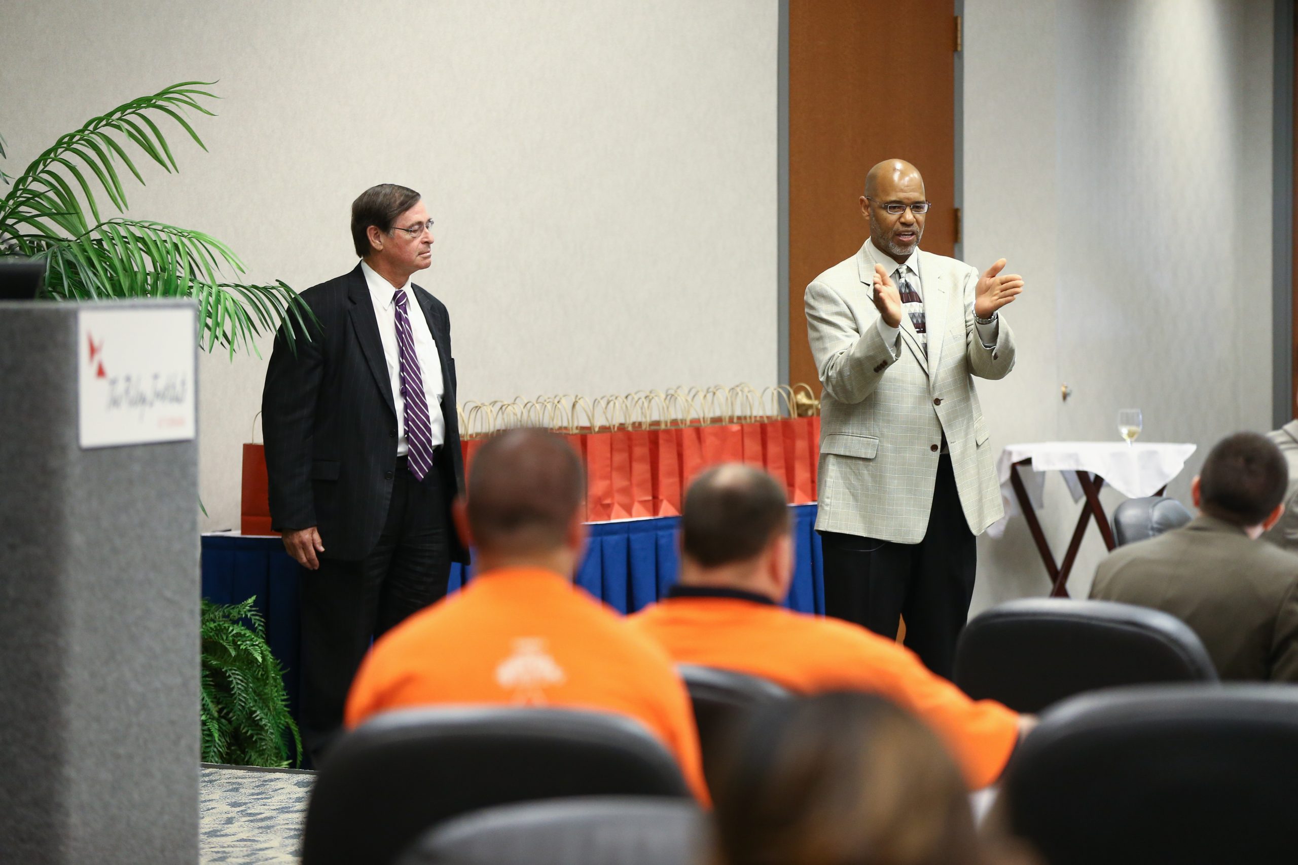 Juan Johnson speaking and Don Gordon