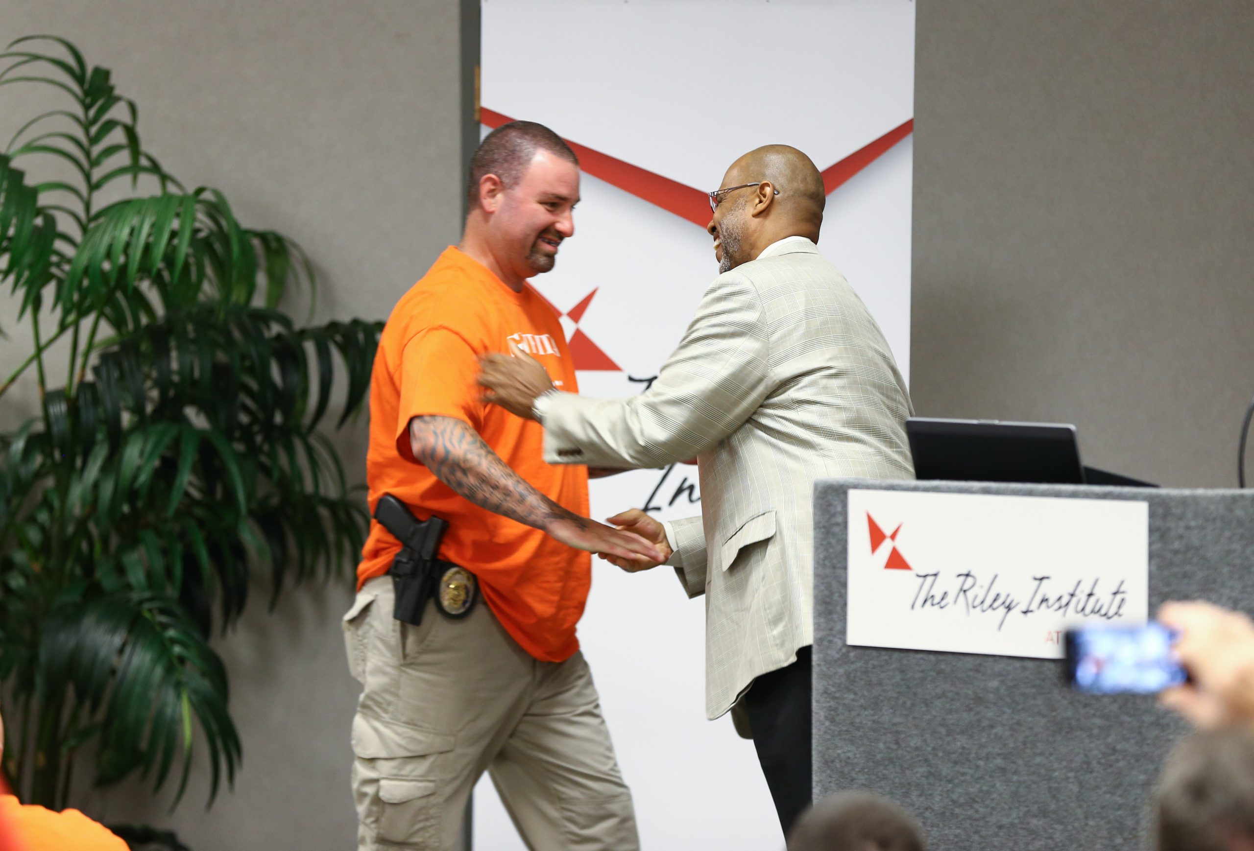 Juan Johnson congratulating Tony Koutsos, Greenville