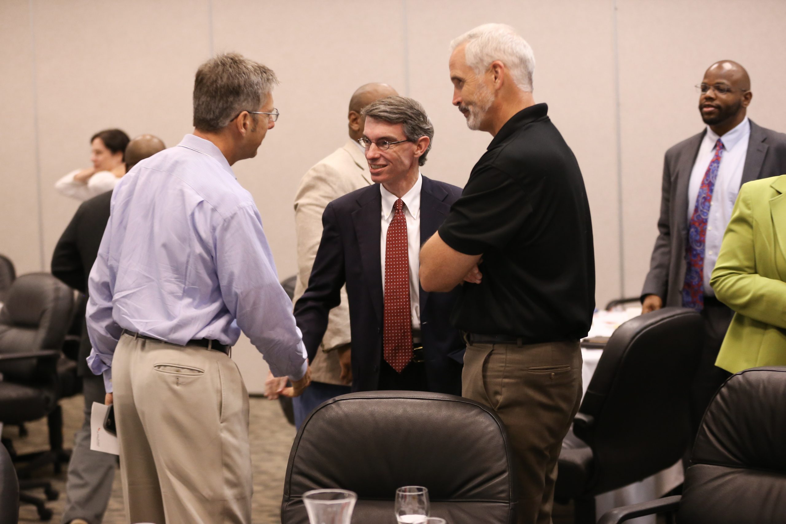 David Dubberly, YLO, and Stephen Cox, Workgroup 4, shaking hands