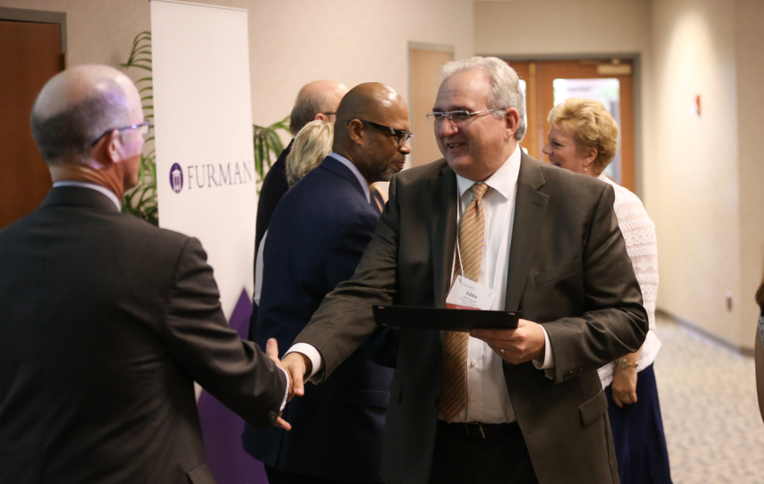 Eddie Ingram, Workgroup 4, receiving his Riley Fellow certificate