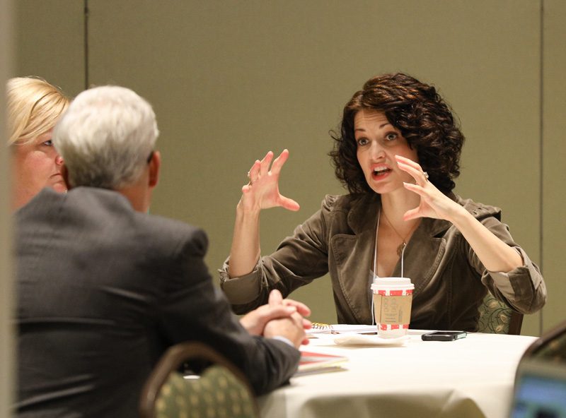 Merridith Crowe speaking with team members Blan Holman and Laura Evans, Charleston Undertold History Map