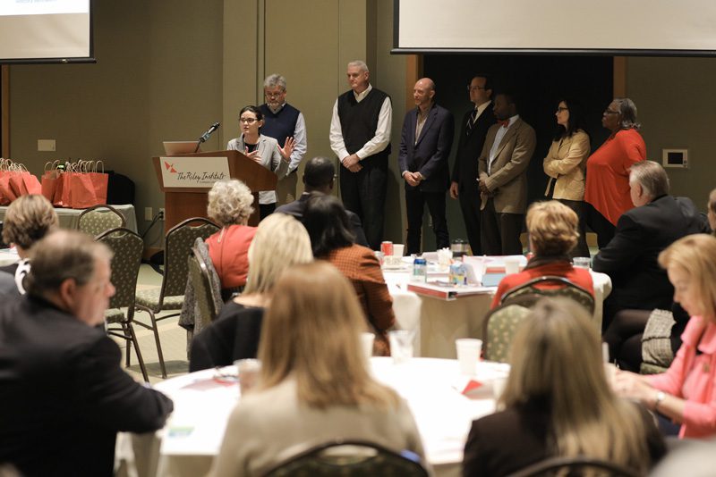 Explorers: (l-r) Mica Dolan speaking, Rick Maxey, Reggie Gosnell, Patrick Bryant, Jeff Tibbals, Craig Ascue, Edie Blakeslee and Jackie Heyward