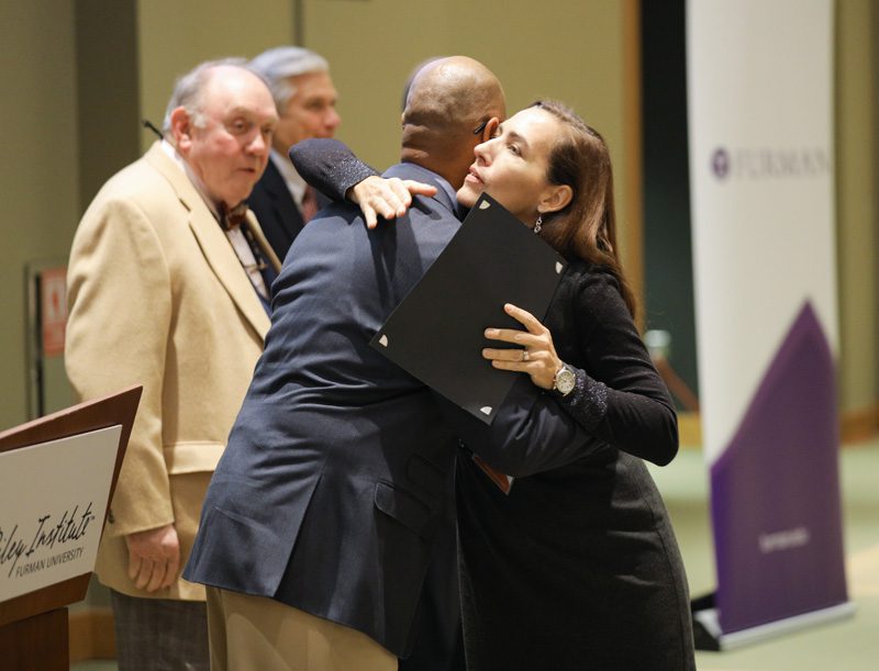 A thank you hug for Juan! Terri Boone, Team Hot Spot, receiving her Riley Fellow certificate