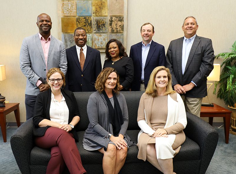 Team One: Row 1 (l-r): Laura Bordeaux, Bunnie Ward, Marti Bluestein; Row 2 (l-r): Desé Zuberi, Wilbur Cave, Gwen Hampton, Michael Seezen, Joe Johnson Not pictured: Steve Brook