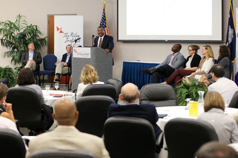 Team One: Joe Johnson, Michael Seezen, Wilbur Cave speaking, Desé Zuberi, Laura Bordeaux, Marti Bluestein and Bunnie Ward