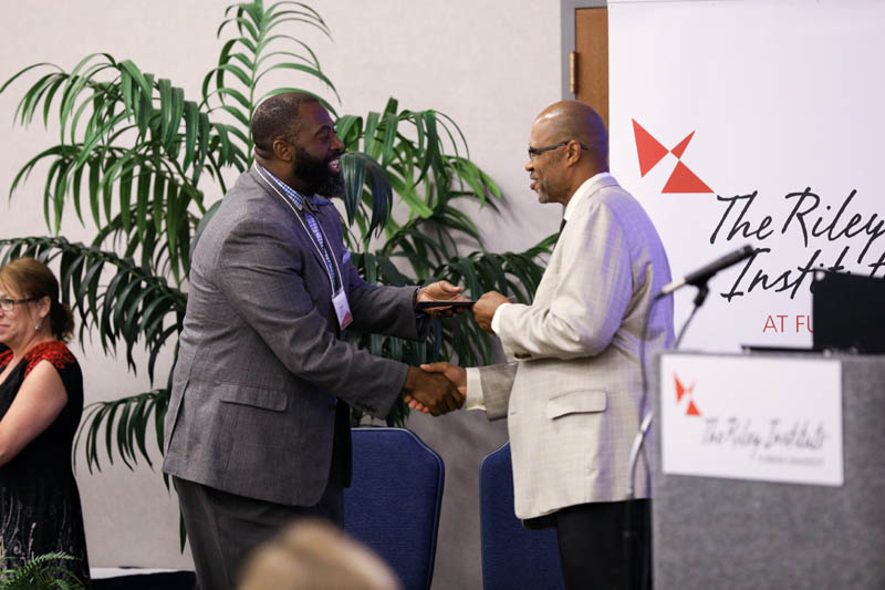 Baron Davis, Career Motivators, receiving his Riley Fellow certificate from Juan Johnson
