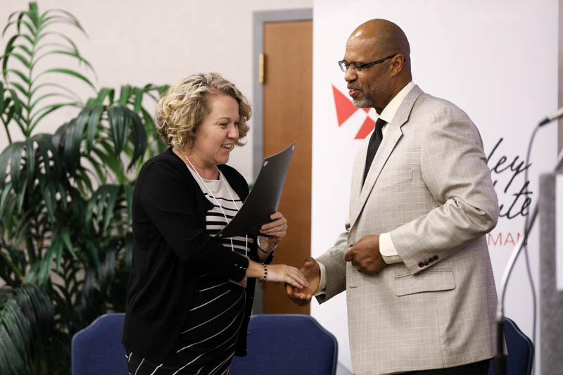 Rebecca Vance, The Home Team, receiving her Riley Fellow certificate from Juan Johnson