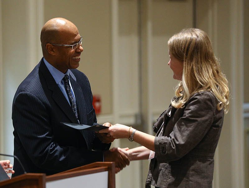 Melanie Armstrong, Fostering Hope, receiving her Riley Fellow certificate from Juan Johnson