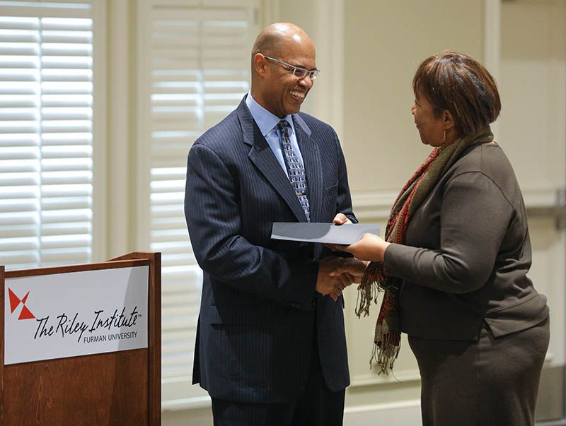 Yvonne Duckett, PW Chop, receiving her Riley Fellow certificate from Juan Johnson