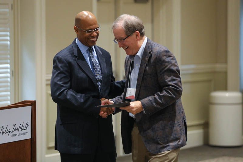 Ed Good, Fostering Hope, receiving his Riley Fellow certificate from Juan Johnson