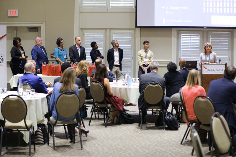(l-r) Ivory Mathews, Bill Schmidt, Susan Riordan, Dennis Dunn, Cynthia King, Nathan Stock, Chris Giacomaro and Samantha Wallace speaking, Freshmen to Finish