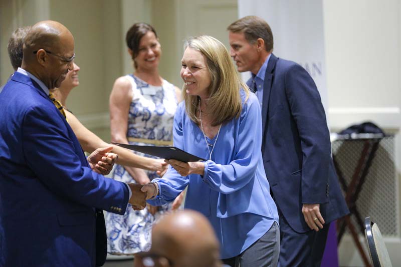 Jill Fuson, COPA Champions, receiving her Riley Fellow certificate from Juan Johnson