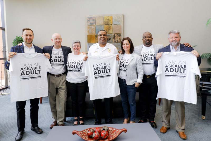 Askable Adults team members (l-r): John Loveday, Kevin Patten, Beth De Santis, Melron Kelly, Melanie Huggins, Virgil Miller and Graham Adams; not pictured: April Allen and LaJoia Broughton