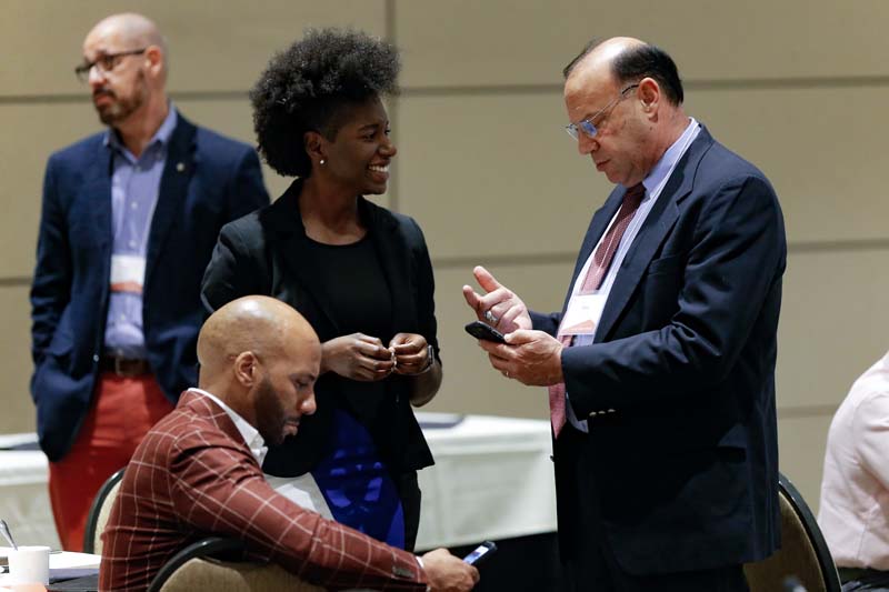 (l-r) Troy Terry, Blue Pearl Club Connectors, Tiffane Thompson, Book Bags of Love, and Mike Ungar, DLI Carry On Crew; Kenneth Dean (seated), Book Bags of Love