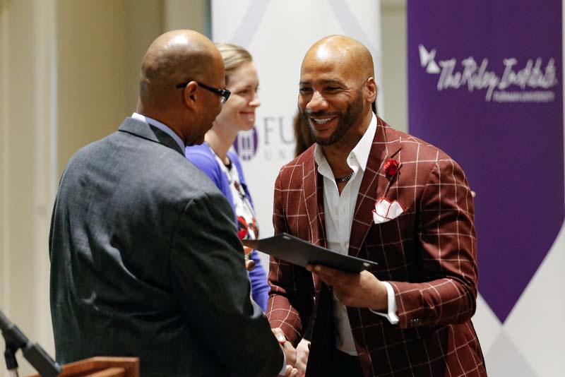 Kenneth Dean, Book Bags of Love, receiving his Riley Fellow certificate from Juan Johnson
