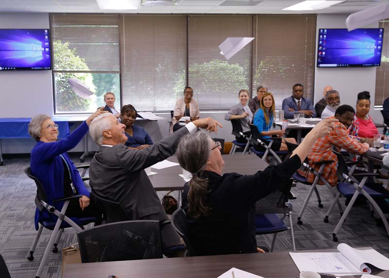 Participants were asked to build paper airplanes and see whose would travel the furthest