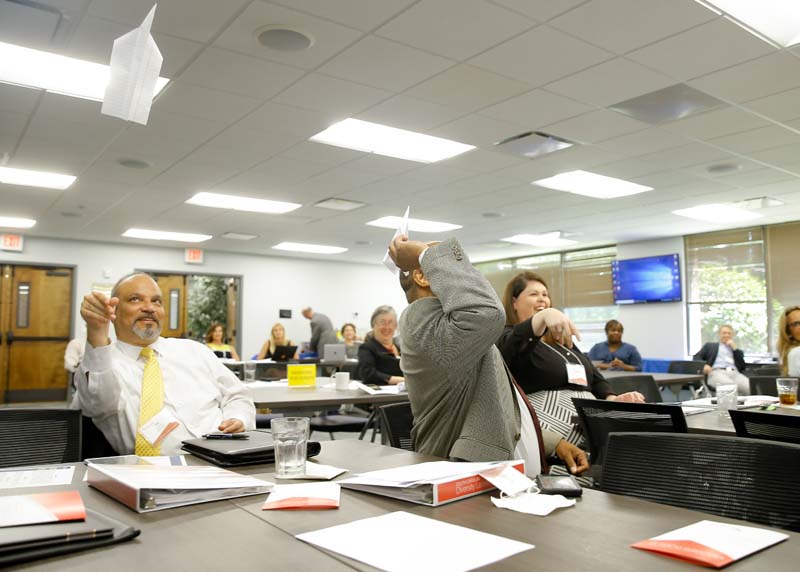 Participants were asked to build paper airplanes and see whose would travel the furthest