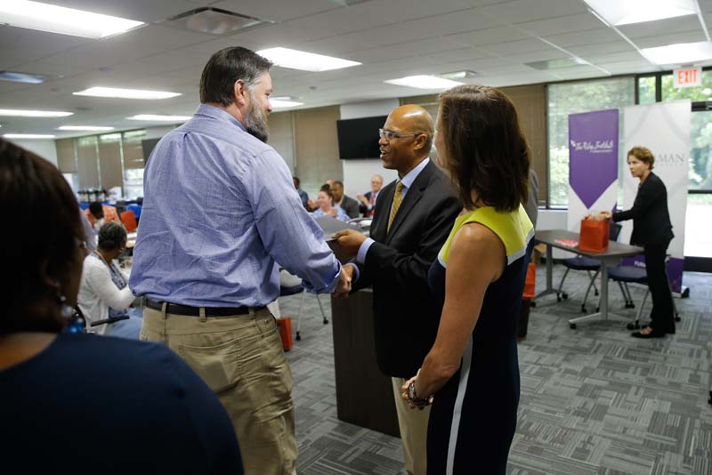 Scott Huffmon, Food for Thought, receiving his Riley Fellow certificate from Juan Johnson