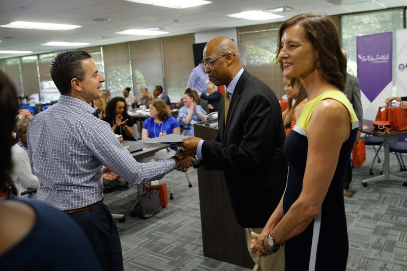 Manny Licata, Food for Thought, receiving his Riley Fellow certificate from Juan Johnson