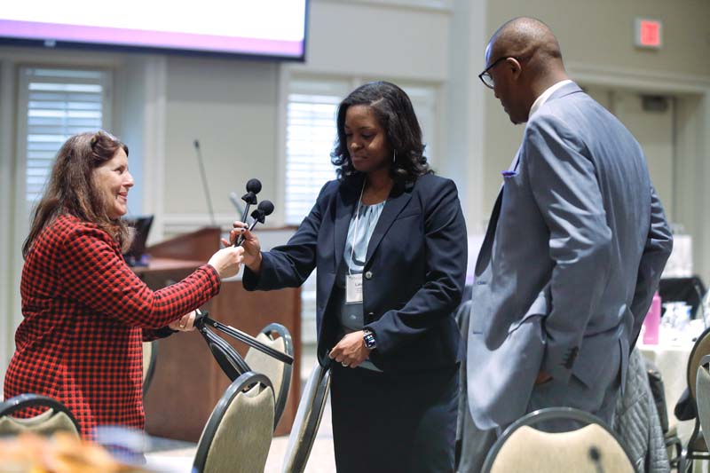 Lakessa Wright receiving a percussion instrument, Bridge to Success, and Darren Wright, R3