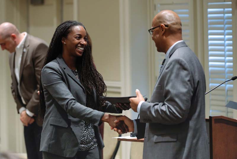 Delia Allen, R3, receiving her Riley Fellow certificate from Juan Johnson