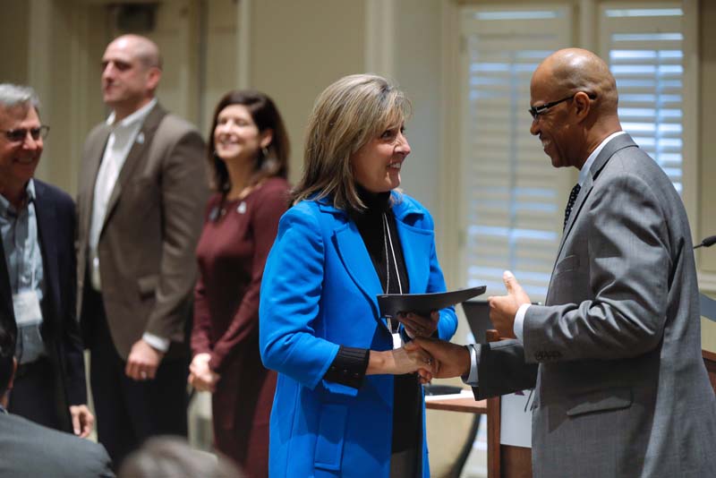 Angie Ayers, Bridge to Success, receiving her Riley Fellow certificate from Juan Johnson