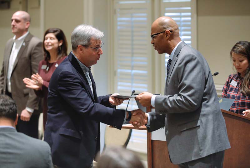 Doyle Bradford, Bridge to Success, receiving his Riley Fellow certificate from Juan Johnson