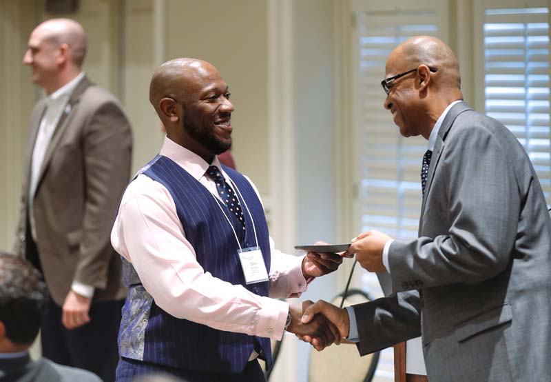 Chris Briddell, Reclaimed, receiving his Riley Fellow certificate from Juan Johnson