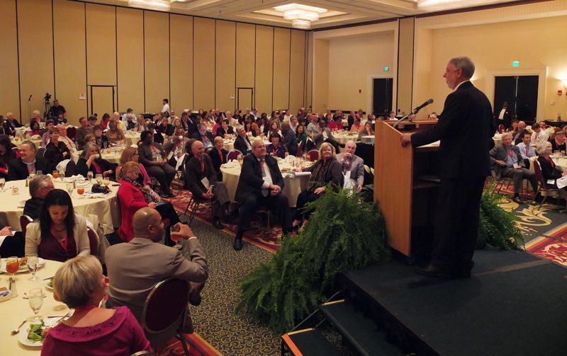 Doug Woodward speaking to the group during lunch about the 