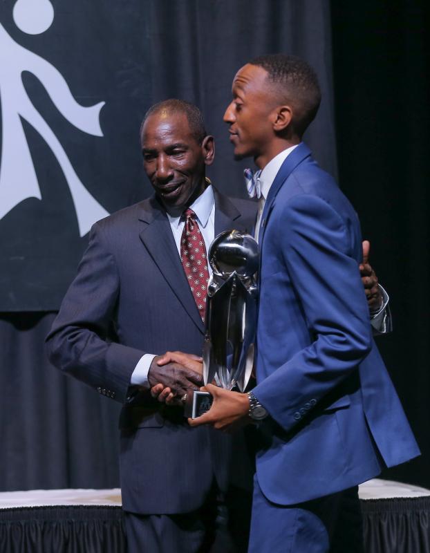 Lee Gill presenting the Outstanding College Student Award to Justus Cox, a senior at Anderson University