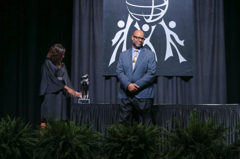 Nika White and Juan Johnson preparing to present the Calder D. Ehrmann Outstanding Individual Award