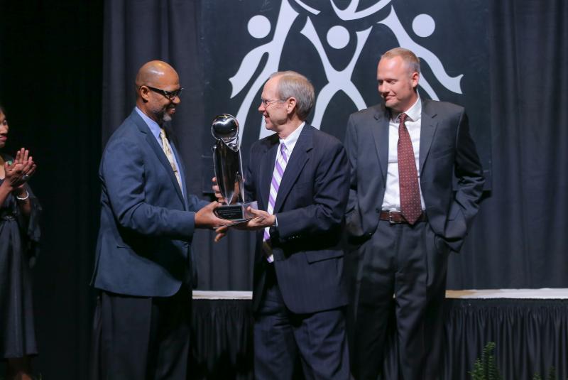 Juan Johnson presenting the Calder D. Ehrmann Outstanding Individual Award to Baxter Wynn