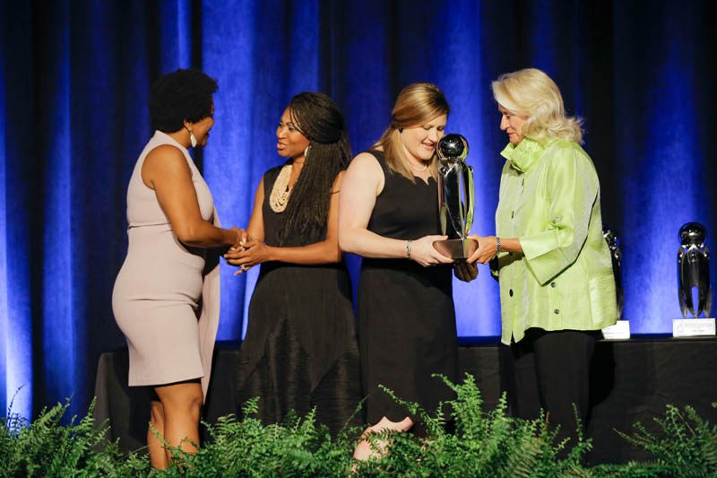 Louise Connell, Supplier Diversity Manager for BMW Manufacturing Co., presenting the Outstanding Nonprofit Organization award to Edward Via College of Osteopathic Medicine – Carolinas (VCOM). Accepting the award are Dr. Lindsey Ridgeway, Assistant Vice President for Student Services and Dr. Doralyn Jones, Assistant Professor for Family Medicine and Osteopathic Manipulative Medicine.