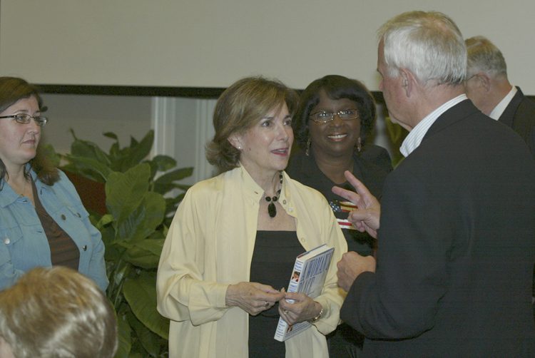 Margolies speaking with guests afterwards