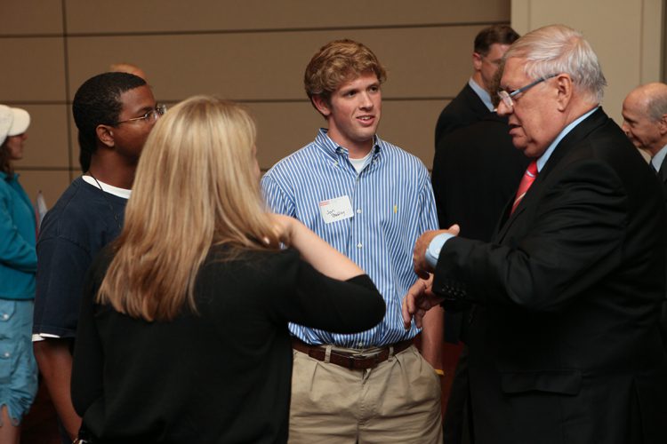 Helmut Schäfer with Furman students following his public address