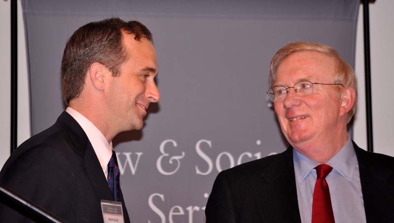 Professor Will Cook confers with The Honorable William 
